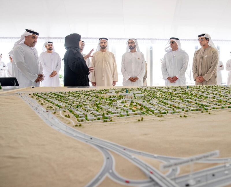 Sheikh Mohammed bin Rashid, Vice President and Ruler of Dubai, looks over plans for a housing development for Emiratis in Ras Al Khaimah in February. Courtesy Dubai Media Office