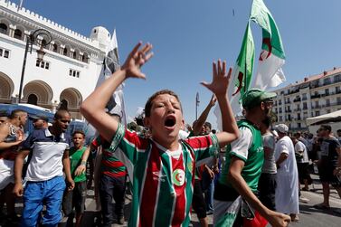 Algerian demonstrators take to the streets in the capital Algiers to protest against the government. Toufik Doudou / AP