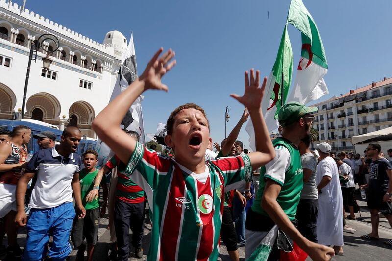 Algerian demonstrators take to the streets in the capital Algiers to protest against the government, in Algeria, Friday, Aug. 16, 2019 (AP Photo/Toufik Doudou)