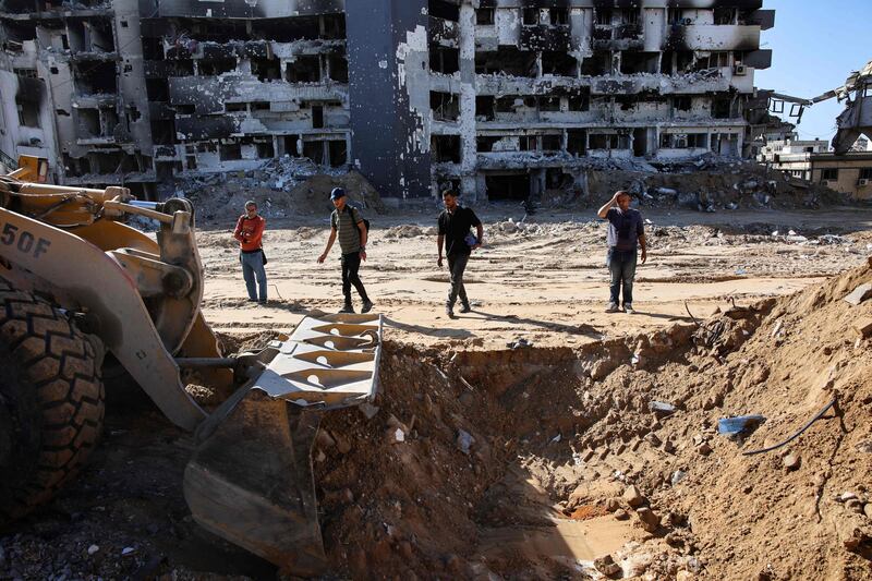 A bulldozer is used to search for mass graves at Al Shifa Hospital in Gaza city this month. AFP