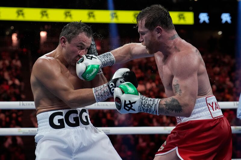 Canelo Alvarez lands a punch on Gennady Golovkin. AP