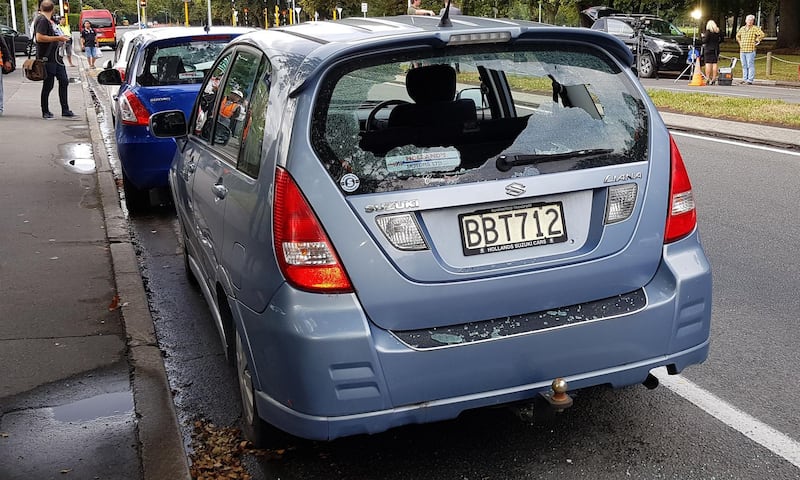 A car with shattered windows is parked close to the mosque after a gunman filming himself firing at worshippers inside in Christchurch on March 15, 2019.  A gunman opened fire inside the Masjid al Noor mosque during afternoon prayers, causing multiple fatalities. / AFP / Flynn FOLEY