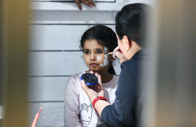 Abu Dhabi, United Arab Emirates - A young girl gets her face painted at the Winter Wonderland event on the Galleria Mall promenade. Khushnum Bhandari for The National