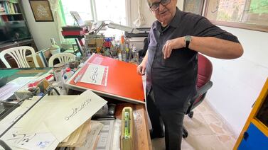 Jordanian calligrapher Ryad Tabbal now works from his home in Amman, after closing his shop due to lack of business. Khaled Yacoub Oweis / The National