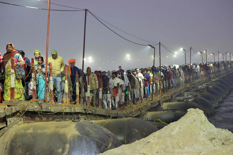 Hindu devotees arrive to take a holy bath at the Sangam, the confluence of the rivers Ganges, Yamuna and mythical Saraswati, on the auspicious bathing day of 'Mauni Amavasya' during the annual fair of Magh Mela festival in Allahabad. AFP