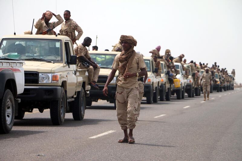 epa06803024 Sudanese forces fighting alongside the Saudi-led coalition in Yemen gather near the outskirts of the western port city of Hodeidah, Yemen, 12 June 2018. According to reports, the Saudi-led military coalition and Yemeni government forces continue to send reinforcements toward the port city of Hodeidah, preparing to launch an assault on the Houthis-controlled main port of Yemen.  EPA/NAJEEB ALMAHBOOBI