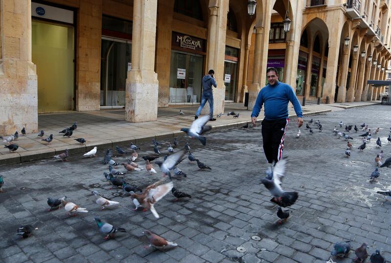 A man strolls down a street leading to Beirut's Parliament Square. Husein Malla / AP Photo