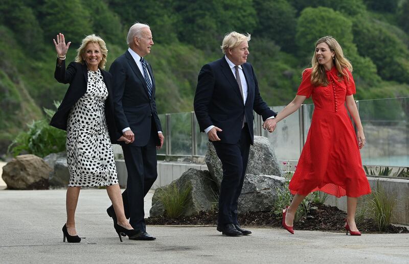 Britain's Prime Minister Boris Johnson (2R) and his wife Carrie Johnson (R) walk with US President Joe Biden and US First Lady Jill Biden, prior to a bi-lateral meeting, at Carbis Bay, Cornwall on June 10, 2021, ahead of the three-day G7 summit being held from 11-13 June.  G7 leaders from Canada, France, Germany, Italy, Japan, the UK and the United States meet this weekend for the first time in nearly two years, for the three-day talks in Carbis Bay, Cornwall. - 
 / AFP / Brendan SMIALOWSKI
