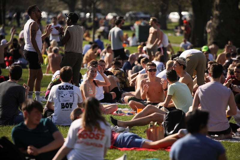 People enjoy the weather at Clapham Common, London. Reuters