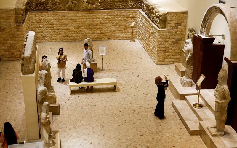 Visitors tour Iraq's National museum in Baghdad. It has reopened to the public after a three-year closure due to the spread of Covid-19 and local unrest. 
