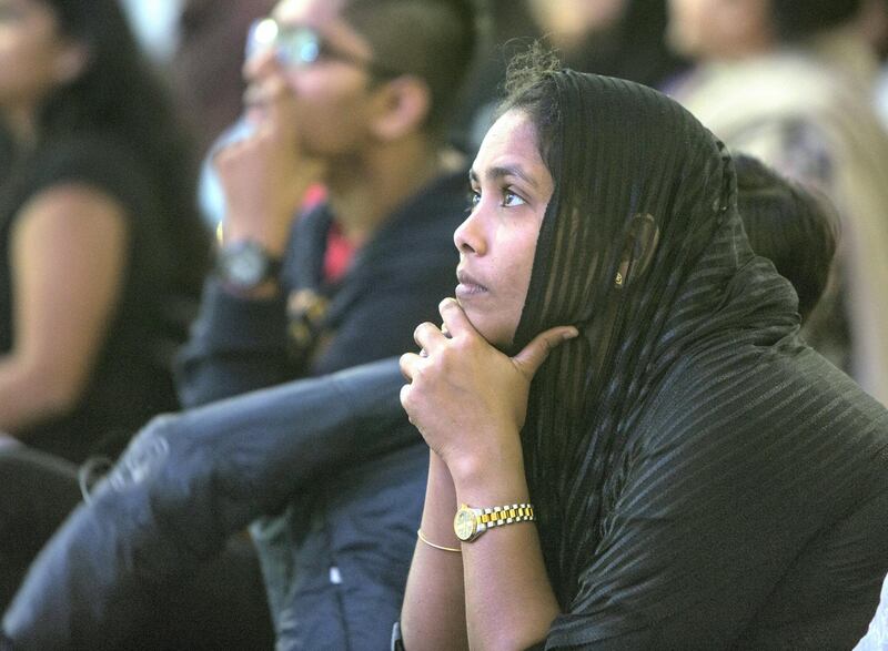 DUBAI, UNITED ARAB EMIRATES - Worshippers listening to the mass  by  Pope  Francis on the screen at St. Mary's Church, Oud Mehta.  Leslie Pableo for The National for Ramolas story