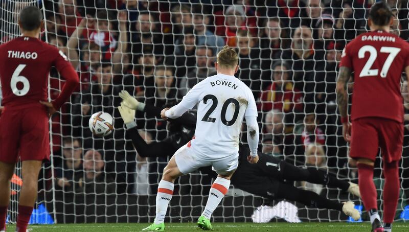 Liverpool goalkeeper Alisson saves Jarrod Bowen's penalty in first half. EPA