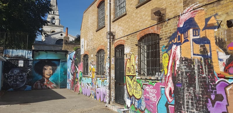 A back alley in Shoreditch covered in street art. Photo by Rosemary Behan