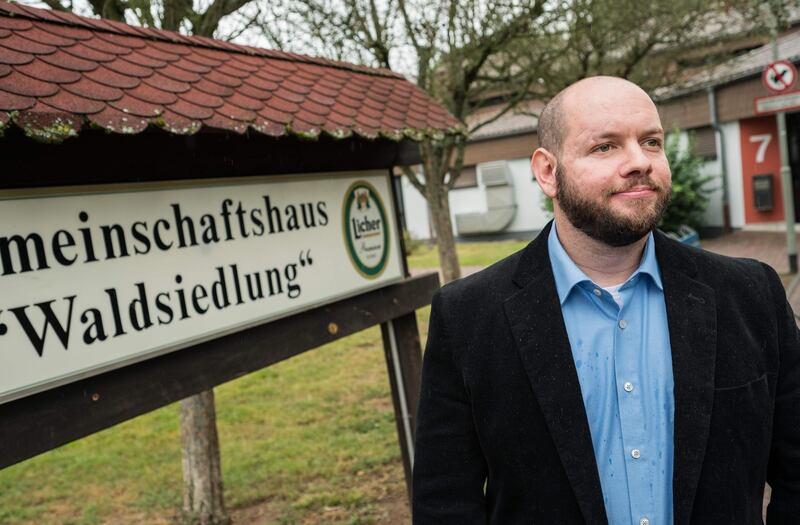 Stefan Jagsch of the far right-wing extremist National Democratic Party (NDP) poses for a photo in from of the community house in Altenstadt-Waldsiedlung, on September 8, 2019. The unanimous election of a neo-Nazi politician in Germany as the head of a town council has sparked outrage among senior political figures and calls to have the decision reversed. A political storm is brewing after Stefan Jagsch of the far right-wing extremist National Democratic Party (NDP) became council leader for the small town of Waldsiedlung, in the district of Altenstadt, 30 kilometres (18 miles) north-east of Frankfurt, on Thursday. - Germany OUT
 / AFP / dpa / Andreas Arnold
