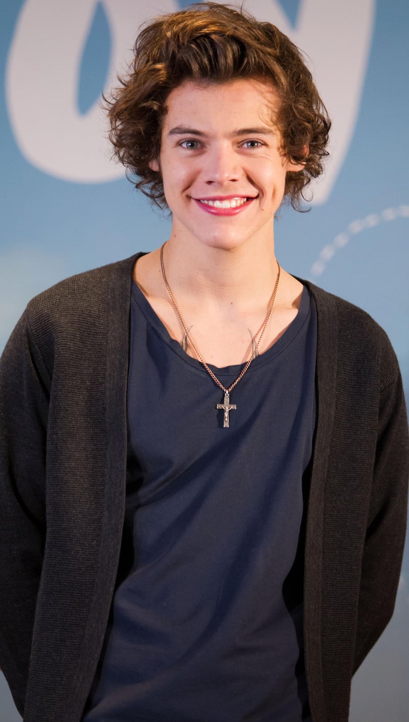 epa03541996 Harry Styles of English-Irish pop boy band One Direction attends a press conference to promote their group's second latest album 'Take Me Home' in Tokyo, Japan, 18 January 2013.  EPA/CHRISTOPHER JUE