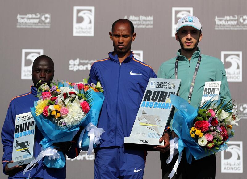 Abu Dhabi, United Arab Emirates - December 06, 2019: 1st, 2nd 3rd to Andrew Kwemoi (L, 2nd), Teresa Gela (m, winner) and Noaman Elassaoui (L, 3rd) for the mens 10k at the ADNOC Abu Dhabi marathon 2019. Friday, December 6th, 2019. Abu Dhabi. Chris Whiteoak / The National