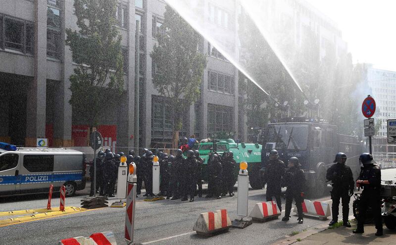 German police use a water cannon during a demonstration at the G20 summit. Pawel Kopczynski / Reuters