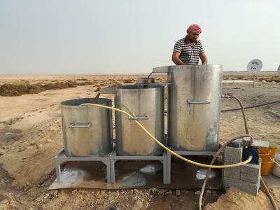 Kevin Lidour sieving sediment at Marawah Island, where almost 8,000 fish bones were recovered. Courtesy: Kevin Lidour