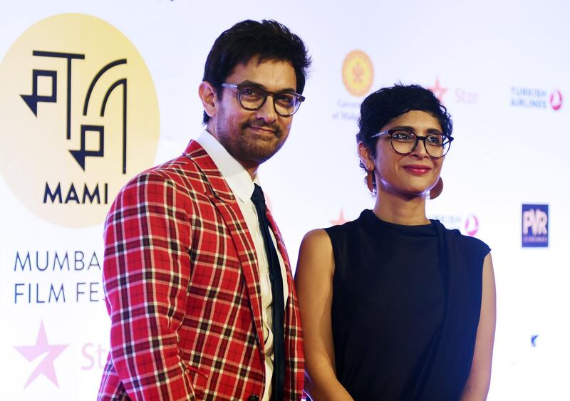 Indian Bollywood actor Aamir Khan and film producer and wife Kiran Rao attend the opening ceremony of the Jio MAMI 20th Mumbai Film Festival 2018, in Mumbai on October 25, 2018. (Photo by Sujit Jaiswal / AFP)