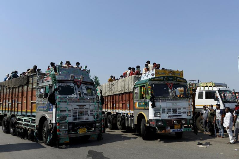 Migrant workers  on the outskirts of Hyderabad travel on a lorry to return to their hometowns.  AFP