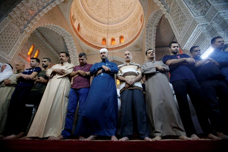 People attend prayers on the first day of Eid Al Adha in Baghdad, Iraq. Khalid Al Mousily / Reuters