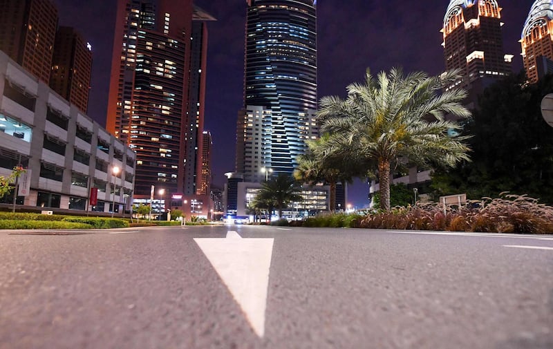 Pedestrian and cycling paths stand empty after people rushed home ahead the curfew. Business Central Towers near Media City can be seen on the right. AFP