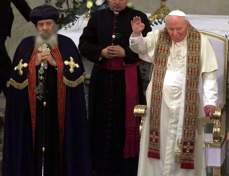 Pope John Paul II and Pope Shenouda III of the Coptic Orthodox Church at an ecumenical service at Our Lady of Egypt Cathedral in Cairo on February 25, 2000. Pope John Paul made a three-day trip to Egypt that year. Reuters

PH/WS