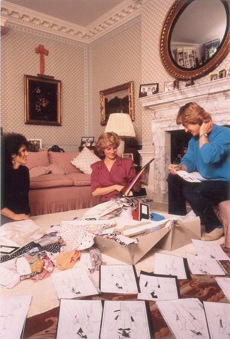 Princess Diana with David and Elizabeth Emanuel, who designed a burqa outfit for her 1986 Gulf tour. Courtesy: RR Auction