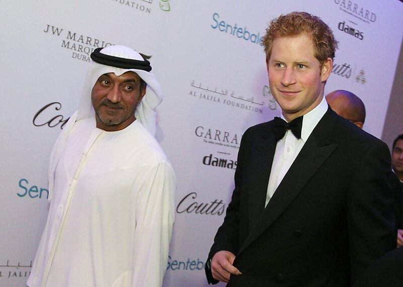 Sheikh Ahmed bin Saeed Al Maktoum (left), chairman of the Emirates Aviation Group walking down the red carpet with Britain's Prince Harry as they arrive at the Sentebale charity evernt Forget-Me-Not Dinner at JW Marriott Marquis Hotel in Dubai. Ali Haider/EPA