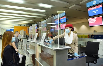 Emirates has introduced safety measures, including plexi-glass screens at check-in