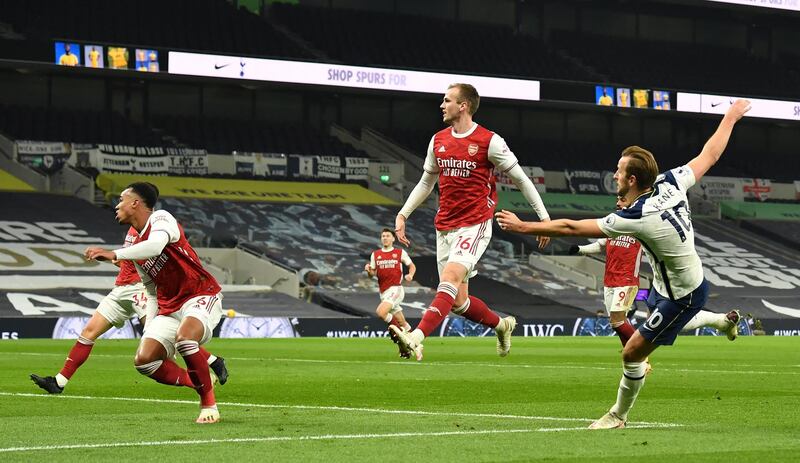 Harry Kane scores against Arsenal on Sunday. EPA