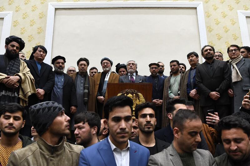 Afghan presidential election opposition candidate Abdullah Abdullah, centre,  takes part in a press conference after the announcement of the final presidential elections results at the Sapedar Palace in Kabul. AFP