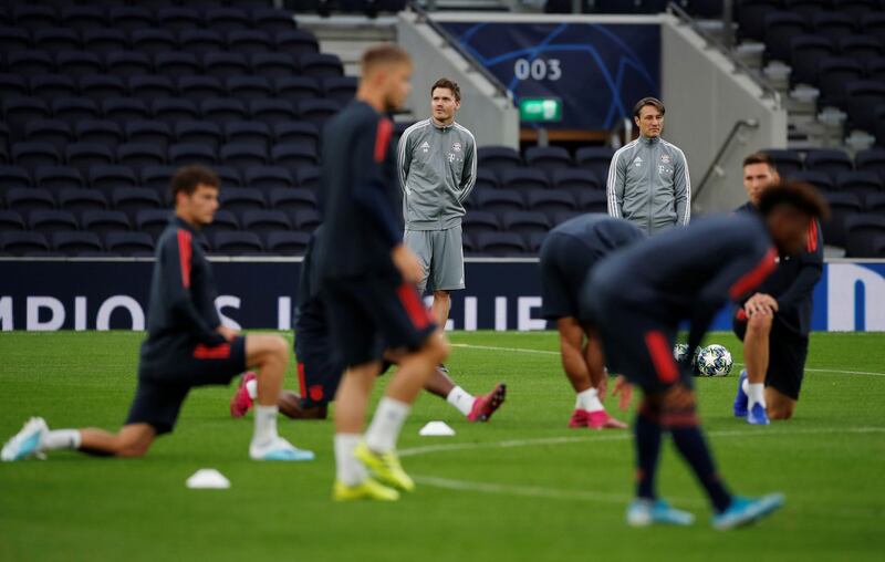 Bayern Munich coach Niko Kovac and assistant coach analytics Danny Rohl observe players during training. Reuters