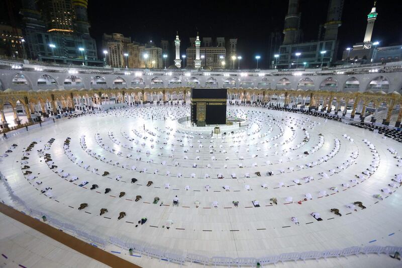 Worshippers perform the evening taraweeh prayer during Ramadan  around the Kaaba in the Grand Mosque complex in Makkah. Saudi authorities said on April 5 only people immunised against Covid-19 will be allowed to perform the year-round Umrah pilgrimage from the start of Ramadan, the fasting month for Muslims. AFP