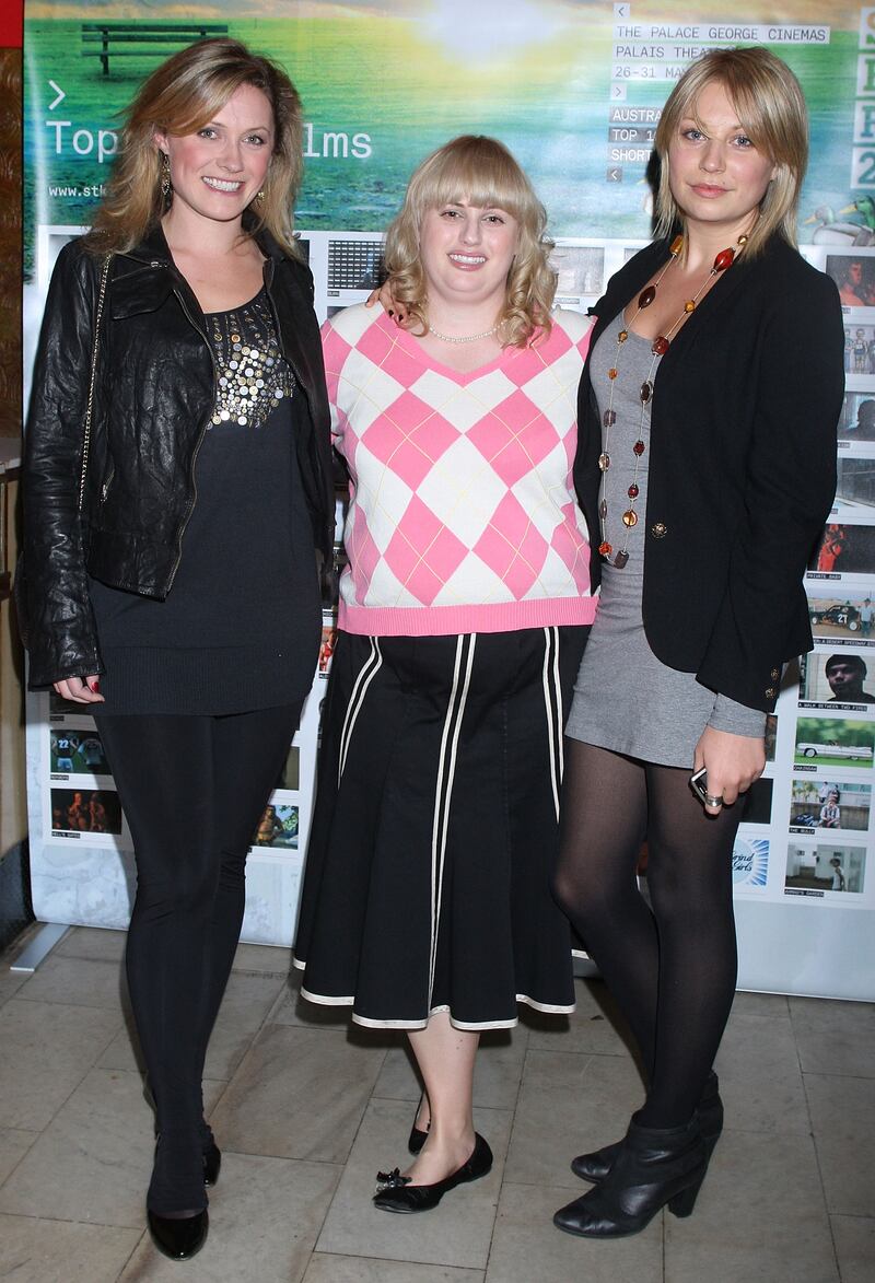 From left, Kate Jenkins, Rebel Wilson – wearing a black skirt and Pringle-style jumper – and Marney McQueen arrive at the St Kilda Film Festival opening night on May 26, 2009 in Melbourne, Australia. Getty Images