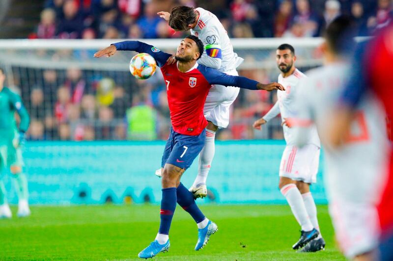 Spain's defender Sergio Ramos (Up) and Norway's forward Joshua King vie for the ball during the Euro 2020 qualifying football match Norway v Spain in Oslo, Norway. AFP