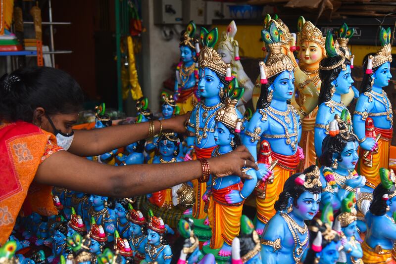 A vendor arranges idols of Krishna in Chennai, India. EPA