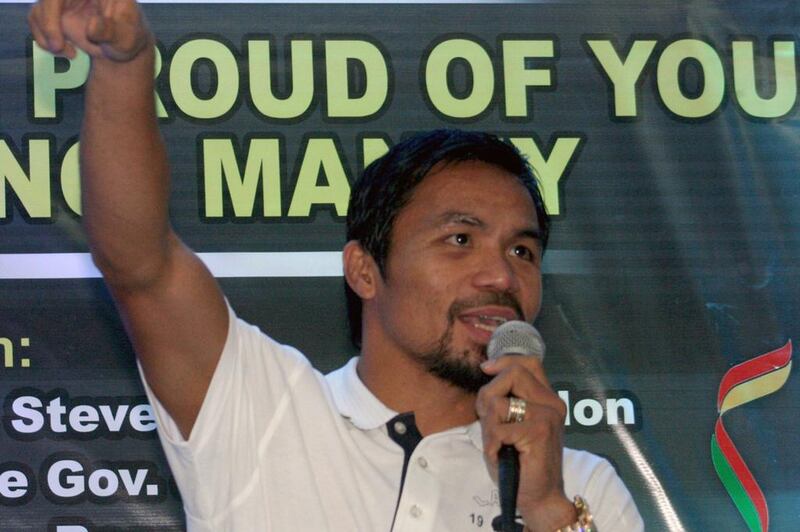 Manny Pacquiao is alleged by the Filipino government to have skipped out on paying his taxes. Raul Bernaldez / AFP
