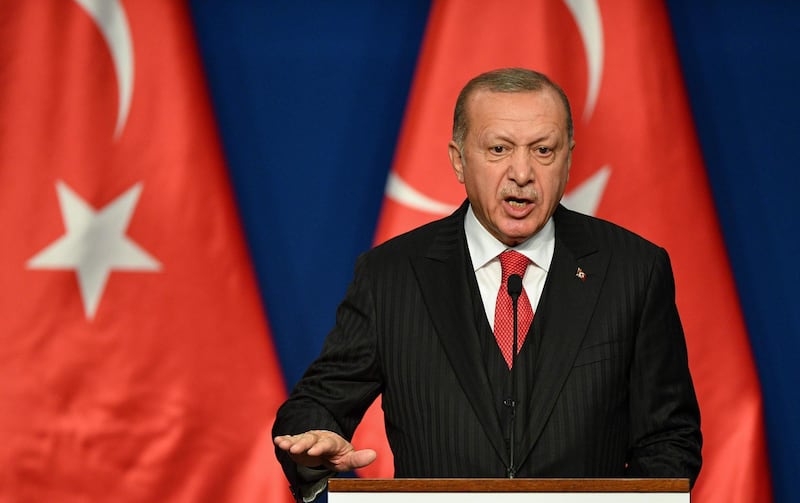 (FILES) In this file photo taken on November 07, 2019 Turkish President Recep Tayyip Erdogan speaks during a joint press conference with Hungarian Prime Minister at Varkert Bazar cultural center in Budapest. The United States will do its "very best" to keep Turkey in NATO, the US national security advisor said Sunday ahead of a White House visit by President Recep Tayyip Erdogan. / AFP / Attila KISBENEDEK

