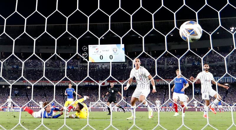 Al Ain's Mohammed Abbas scores Al Ain's first goal. Reuters