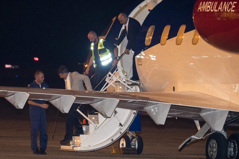 Mr Mossaheb and Mr Ghaderi exit the plane. AFP