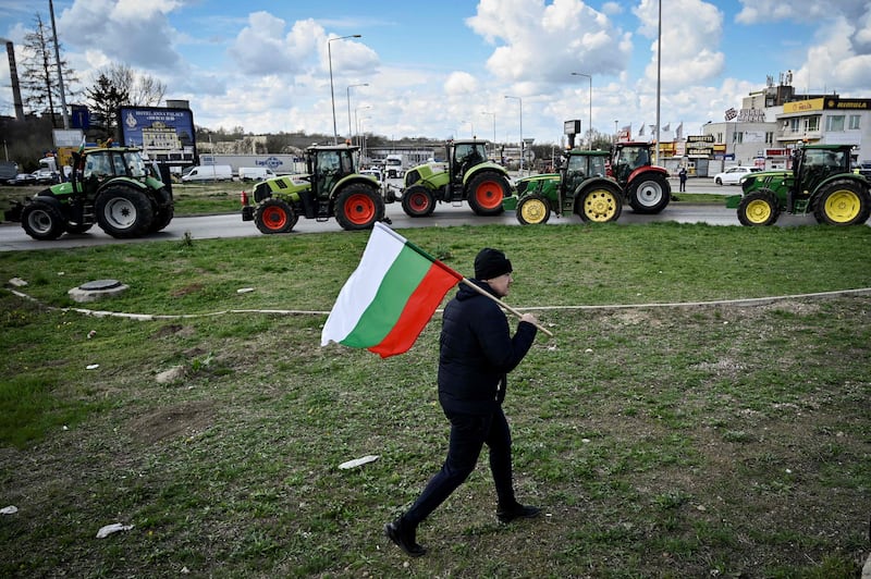 A Bulgarian farmer at a protest to stop trucks carrying Ukrainian grain from crossing the Danube Bridge between Bulgaria and Romania. AFP