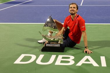 Russia's Daniil Medvedev poses with his trophy after winning against Andrey Rublev (not pictured) during the ATP Dubai Duty Free Tennis Championship final match in Dubai, on March 4, 2023.  (Photo by Karim SAHIB  /  AFP)
