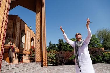 An Afghan man gestures after the prayers during Eid al-Fitr, the Muslim festival marking the end the holy fasting month of Ramadan, at a mosque, amid the spread of the coronavirus disease (COVID-19), in Kabul, Afghanistan May 24, 2020. REUTERS/Mohammad Ismail
