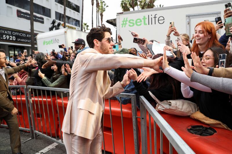 Nick Jonas stops to greet fans. Reuters