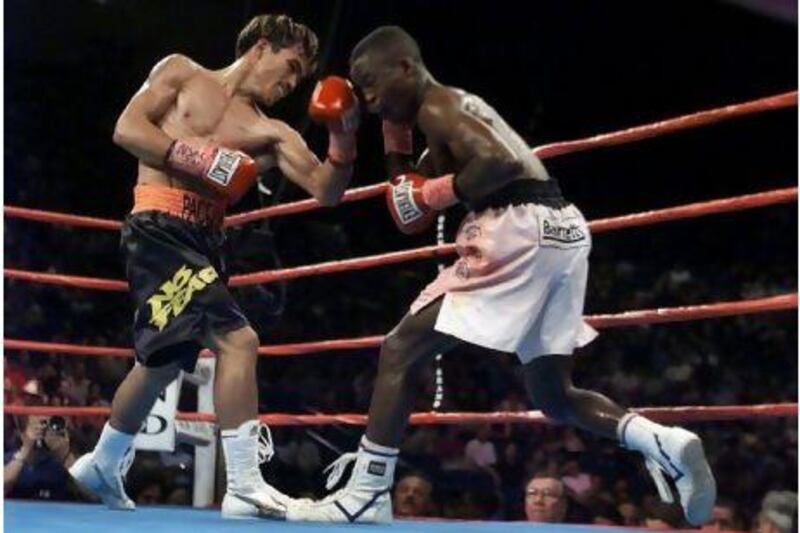 Manny Pacquiao in 2001, took the belt from IBF Super Bantamweight champion Lehlohonolo "Hands of stone" Ledwaba with a sixth round knock out.

REUTERS

SM/JP