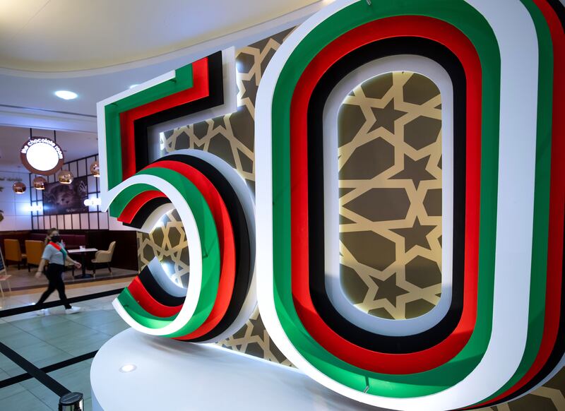 The UAE at 50 National Day decorations at Al Wahda Mall in Abu Dhabi as the country prepares to celebrate five decades since unification. Victor Besa / The National