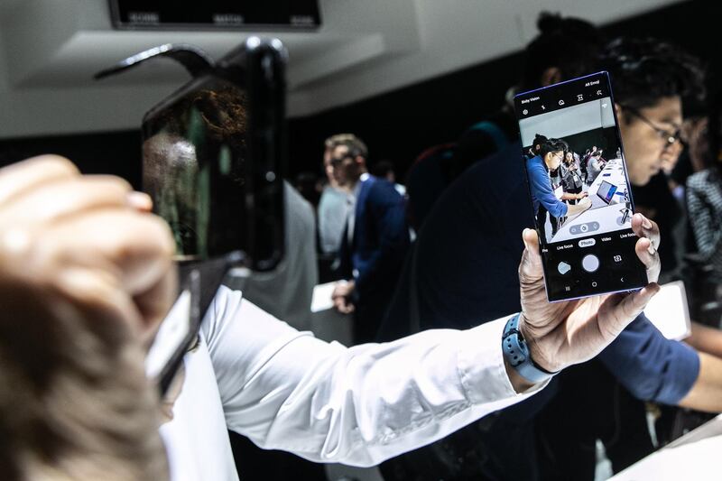 An attendee demonstrates the camera function on a Samsung Galaxy Note 10 device. Bloomberg