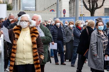 People line up to get the AstraZeneca vaccine outside La Nuvola convention centre in Rome, Italy on Friday. EU member countries reintroduced the AstraZeneca Covid-19 vaccine in their inoculation campaigns. EPA