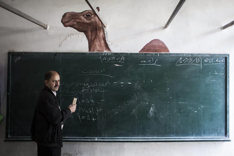 A teacher is seen at a Palestinian Bedouin of Jahaline tribe school.